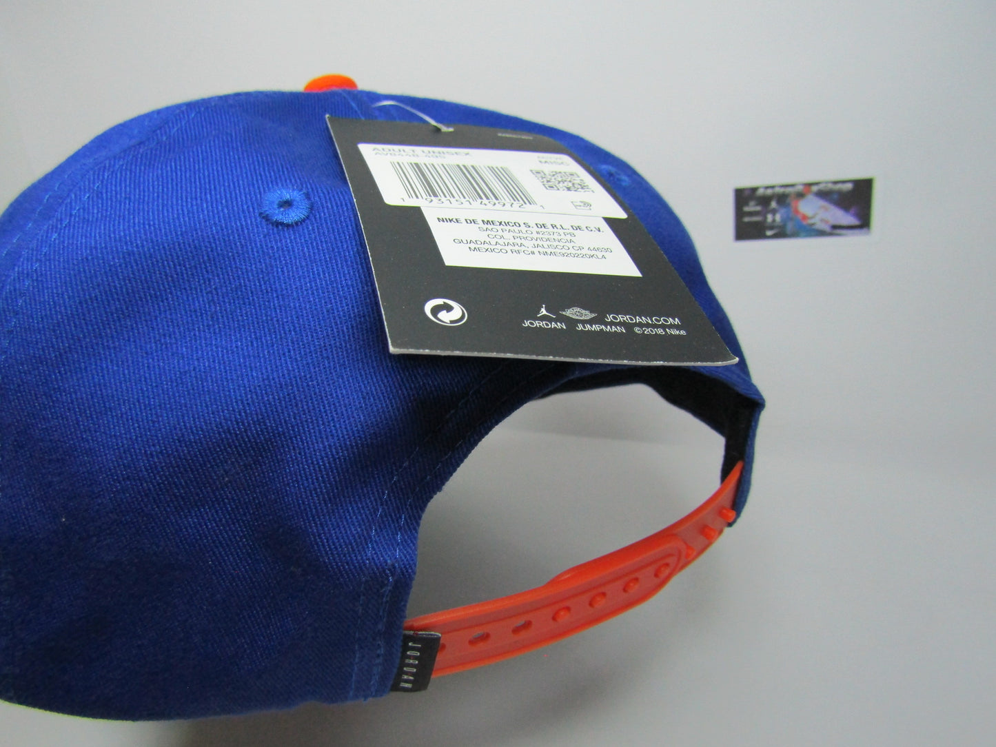 GORRA JORDAN PLANA PRO SCRIPT BLUE ORANGE UNITALLA ADULTO