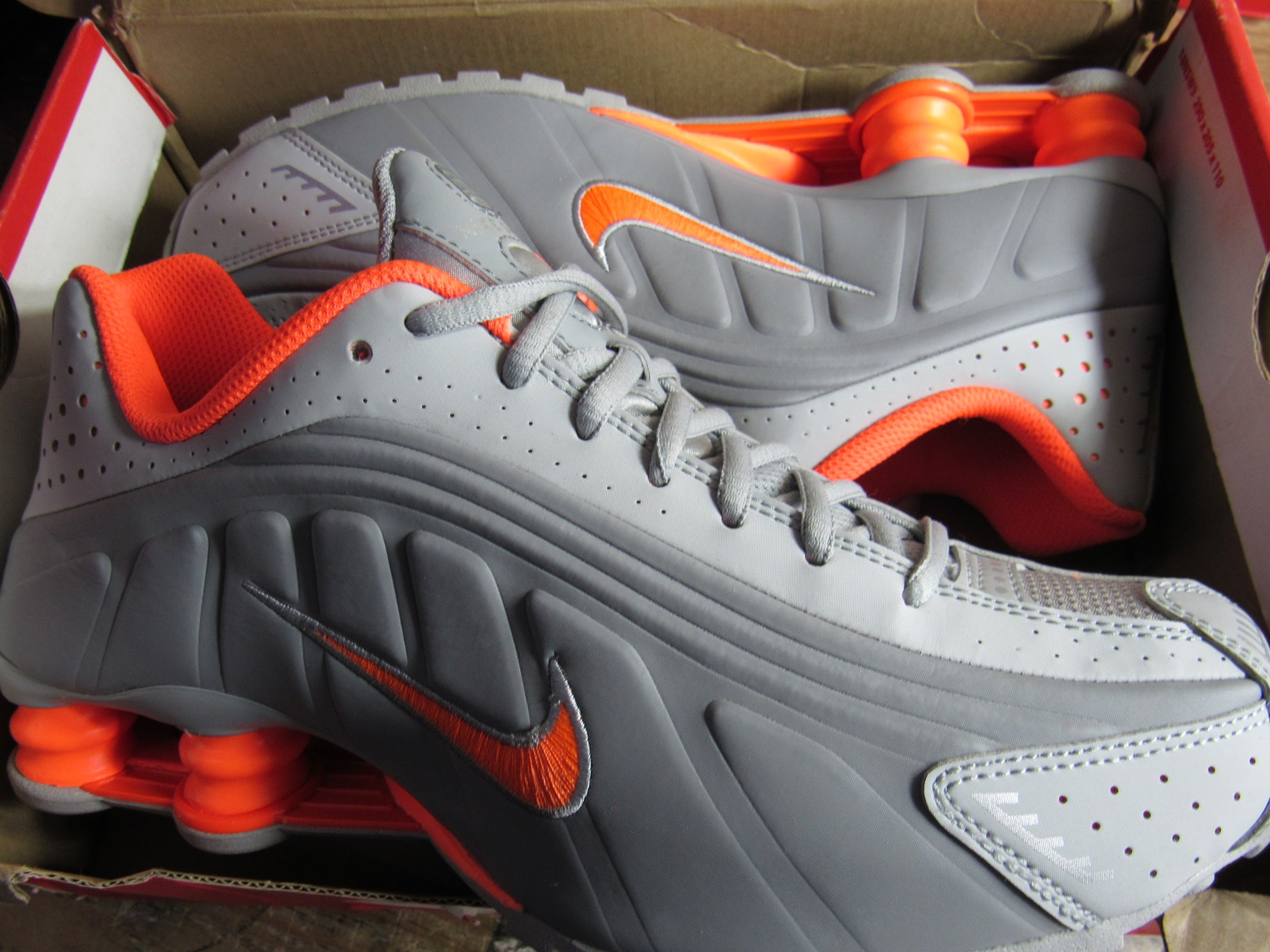 Grey and orange nike best sale