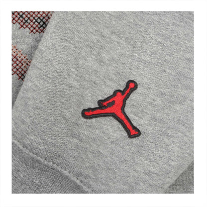 SUDADERA JORDAN ESSENTIALS HOLIDAY GREY BORDADA
